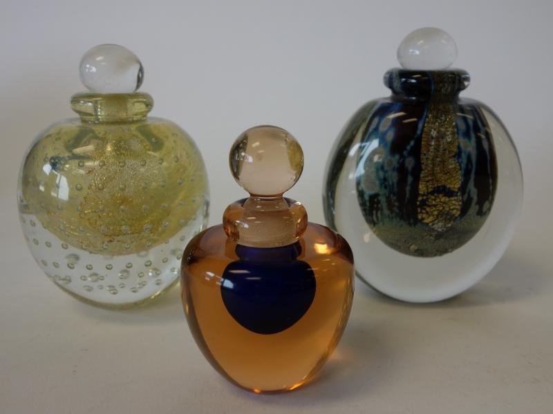 3 Art Glass Perfumes, Murano & Robert Eickholt: Two art glass perfume bottles by Eickholt, signed and dated 1987. Measuring approximately 4.75" high. Together with a cased glass perfume by Murano, Italy, measuring 3-5/8" high. Label on the undersid