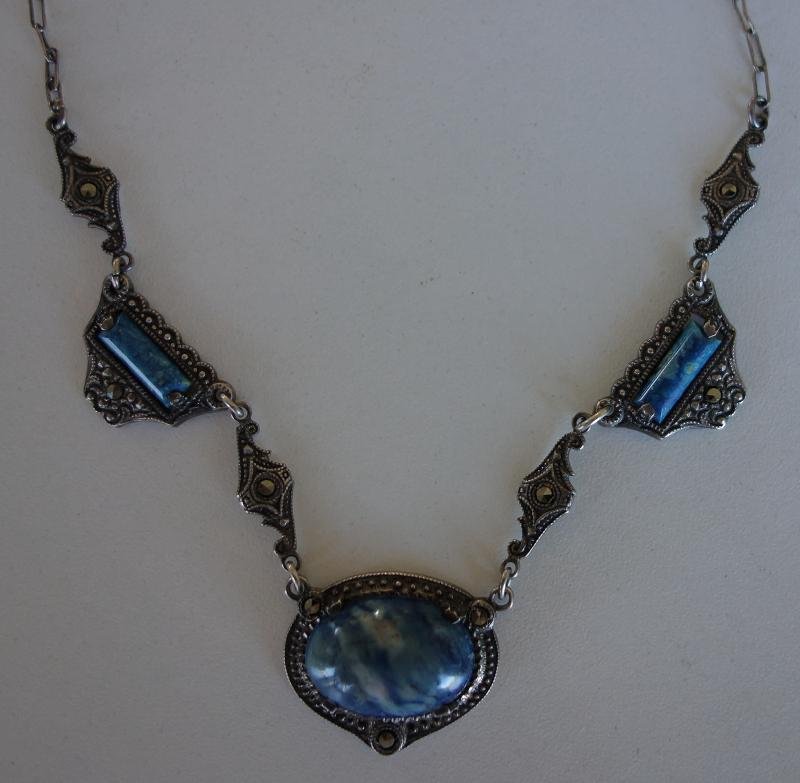 Art Deco Blue Stone & Marcasite Necklace: An Art Deco sterling necklace set with blue semi-precious cabochon stones and marcasites.