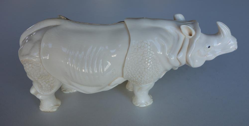 Japanese Carved Ivory Rhinoceros, Signed: Japanese ivory rhinoceros. Finely carved and well detailed rhino measuring 6" x 1" x 2-7/8" high. Signed on the underside with the artist maker's mark. NOTE: Ivory only shipped to a US address.