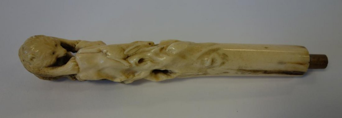 Japanese Bone Cane Handle, Bear & Rabbit, signed: A Japanese bone cane handle. Finely carved handle depicting a bear chasing a rabbit. Signed. Overall measurement 7.75" long.