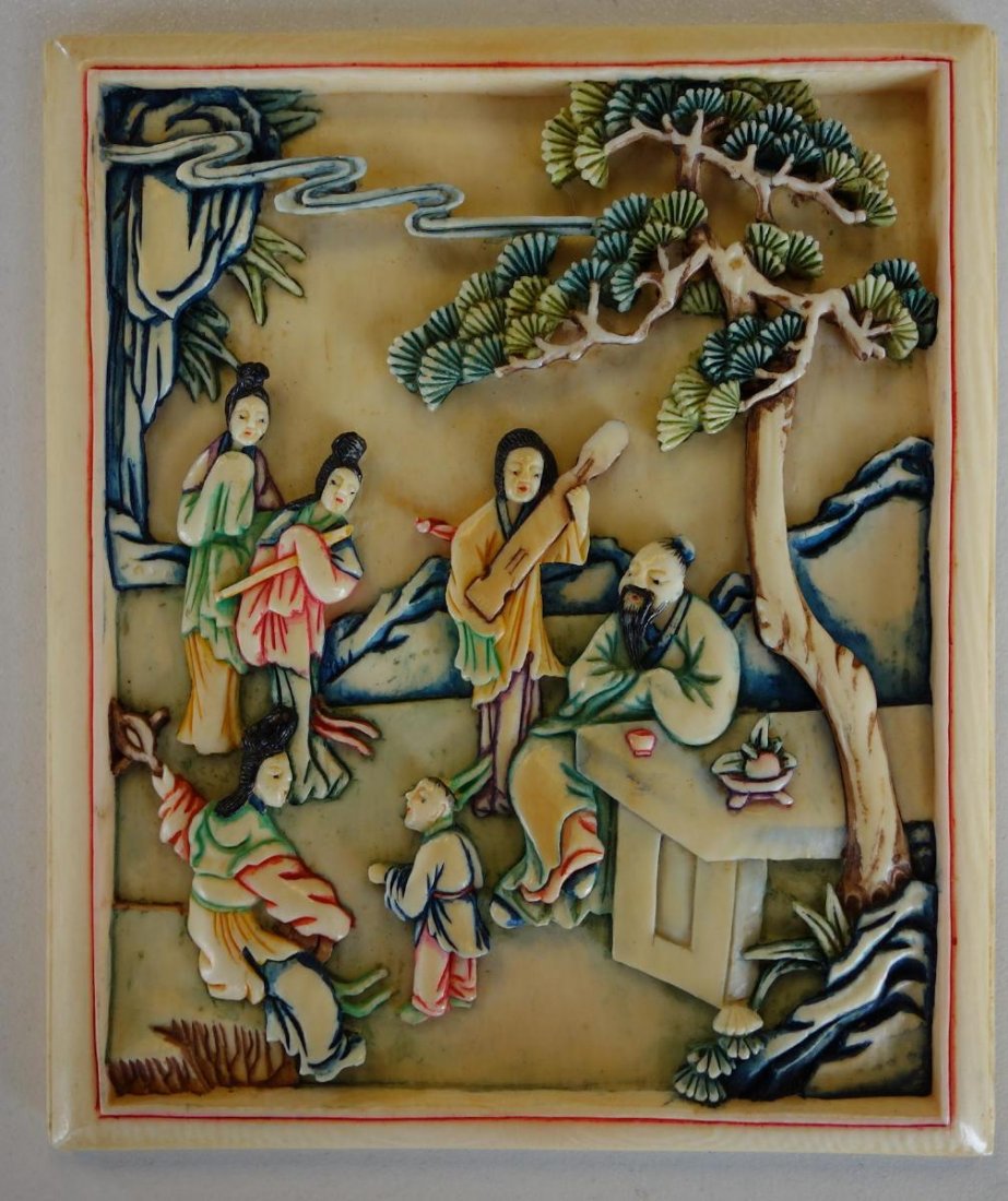 Chinese Polychrome Ivory Plaque, General Stilwell: A Chinese ivory figural plaque. Finely carved polychrome ivory plaque depicting female musicians serenading a male elder and a young boy. Measures 3-5/8" x 3-1/16" x 3/16" thick. NOTE: It is the buyer