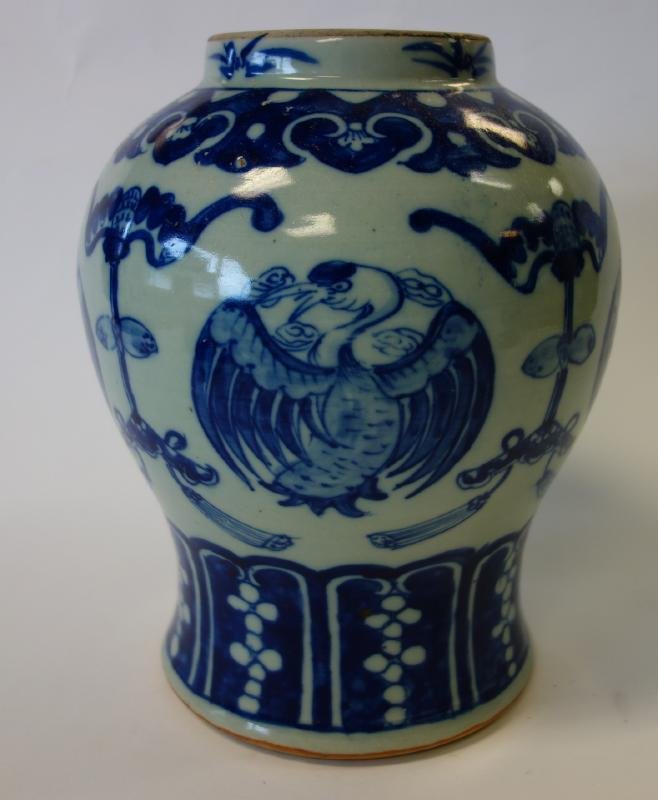 Chinese Blue & White Porcelain Jar: A Chinese blue and white porcelain jar. Stylized phoenix bird and bat motif. Measures 10.5" high and 9" in diameter at the widest point on the body. Note: missing lid.