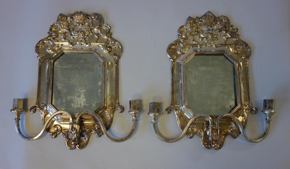 Silverplate Mirrored Sconces, British Crest: A pair of silverplate wall mirrors with double candle sconces. Hallmarks on one indicating the maker; Lawrence B. Smith Co, Boston, MA 1887-1958. The top of each sconce with a variant of the British C