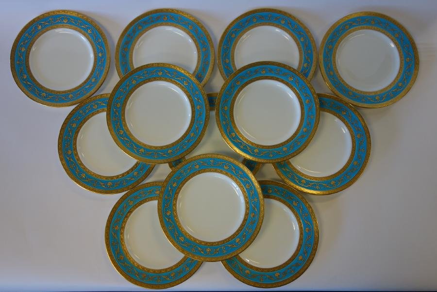 12 Minton for Tiffany, Dinner Plates: A set of 12 porcelain dinner plates measuring 10-1/8" in diameter. By Mintons, made in England and retailed by Tiffany & Co, New York Pattern number H3383. Gilt decorated fruit, floral and swag motif 