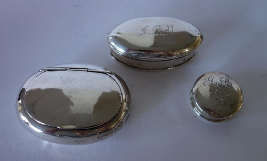 3 English Sterling Silver Boxes: An assembled set of three English sterling silver trinket and pill boxes. Comprised of a round pill box measuring 1.5" in diameter and .5" high. Hallmarked for Chester, Trevitt & Sons, 1901. A lozenge