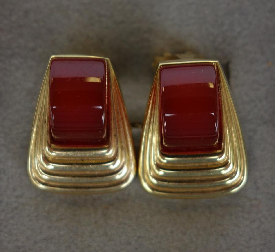 Art Deco 14K Gold & Carnelian Earrings: A pair of 14K gold clip-back earrings. Each set with one rounded carnelian gem stone. Art Deco design. Measures 5/8" x 1/2". Overall weight of the two, 5.8 grams. Stamped 14KT FB.