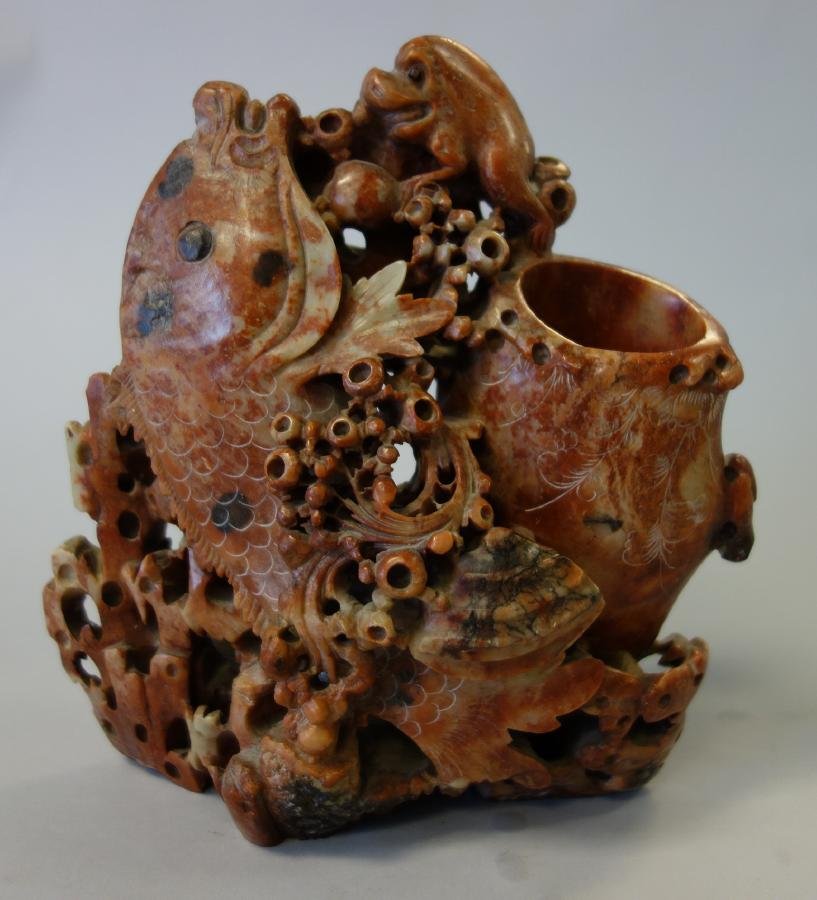 Chinese Soapstone Carving, Fish & Vase: A Chinese soapstone carving. Late 19th / early 20th century. Finely carved scullpture depicting a large fish beside a vase. A foo lion / dog of Fo adorns the top. Measures 7.5" high, 7.5" wide and 3.2