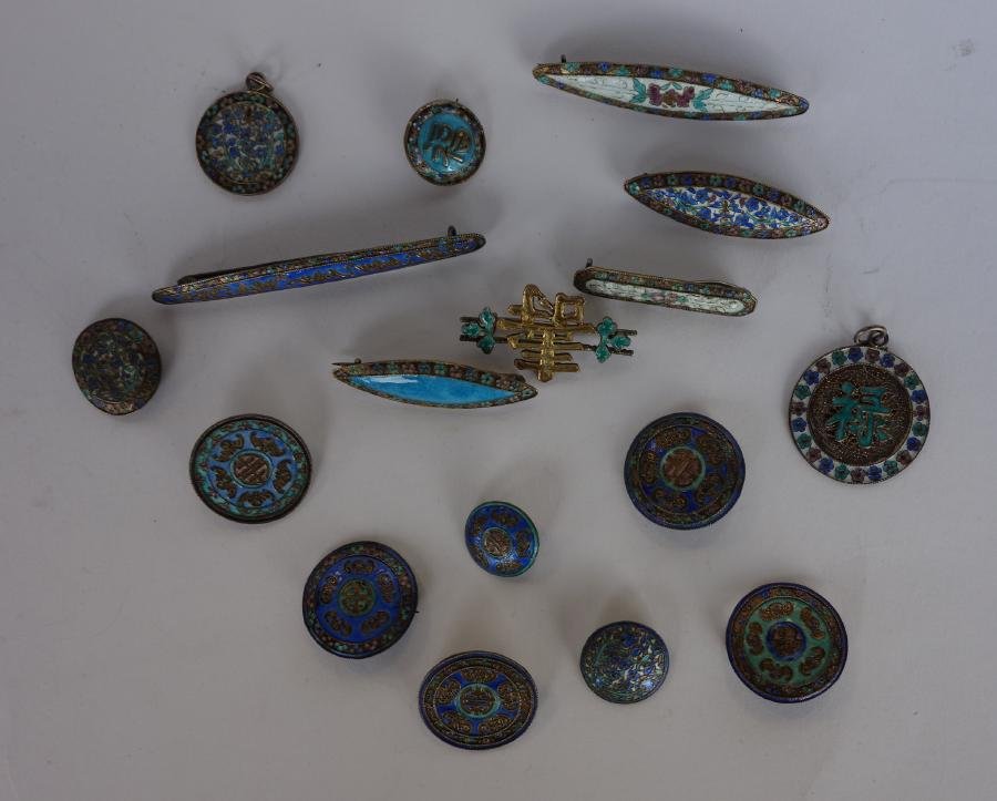 Chinese Enamel & Silver Pin Collection: A collection of 17 pins, brooch pins and pendants Enamel over silver. Depictions of flowers, bats, Chinese Shou motif and other Chinese symbols. The largest measuring 2.75" long. Typical diameters of 
