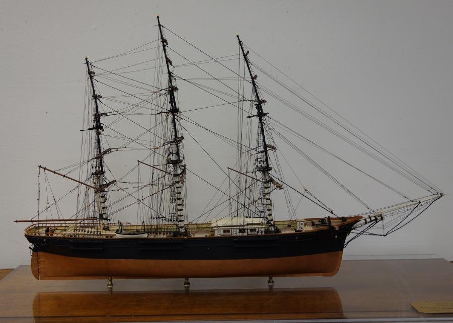 Flying Fish, Clipper Ship Cased Model: Wooden ship model of the clipper ship the Flying Fish. Handmade and built to 1/8 scale by A.W. Pell. Intricately rigged with all appropriate standing and running cords. The ship measures 23" high, 35"