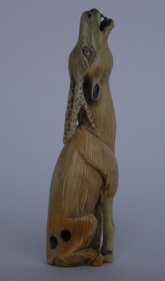 Carved Ivory Howling Stag Netsuke: An ivory netsuke. Finely carved to depict a howling stag with antlers. Measures 3" high. NOTE: It is the buyer's responsibility to arrange shipping of ivory to a legal US address.