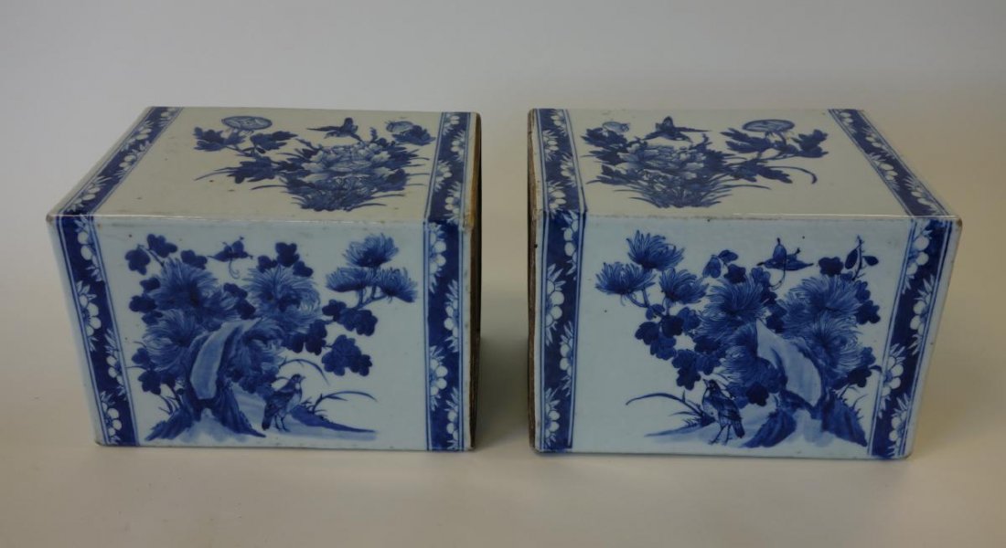 19thc Chinese Blue & White Porcelain Pillows, Pair: A mirrored pair of large Chinese porcelain pillows. 19th century. Underglaze blue decoration depicting panels of florals, birds and flowering trees. Bat motif on two sides. Each measuring 9" x 6" x 7"