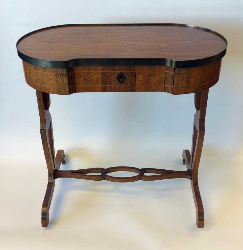 Kidney Shaped Side Table with Drawer, Baker: A kidney-shaped wood side table by Baker Furniture, (metal label tag on the interior of drawer). The shaped top with brass gallery above a small drawer. Measures 28.5" high, 30" wide and 19" deep.