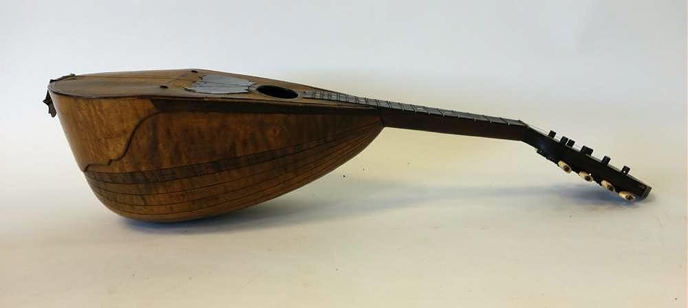 Pasquale Vinaccia Mandolin, Naples 1880: An Antique mandolin by Pasquale Vinaccia. Beautiful woods, mother of pearl inlay, bone tuning pegs. Label on the interior, Pasquale Vinaccia e Figli" Napoli 1880. Measures 24" long 5.5" deep. Note: mi