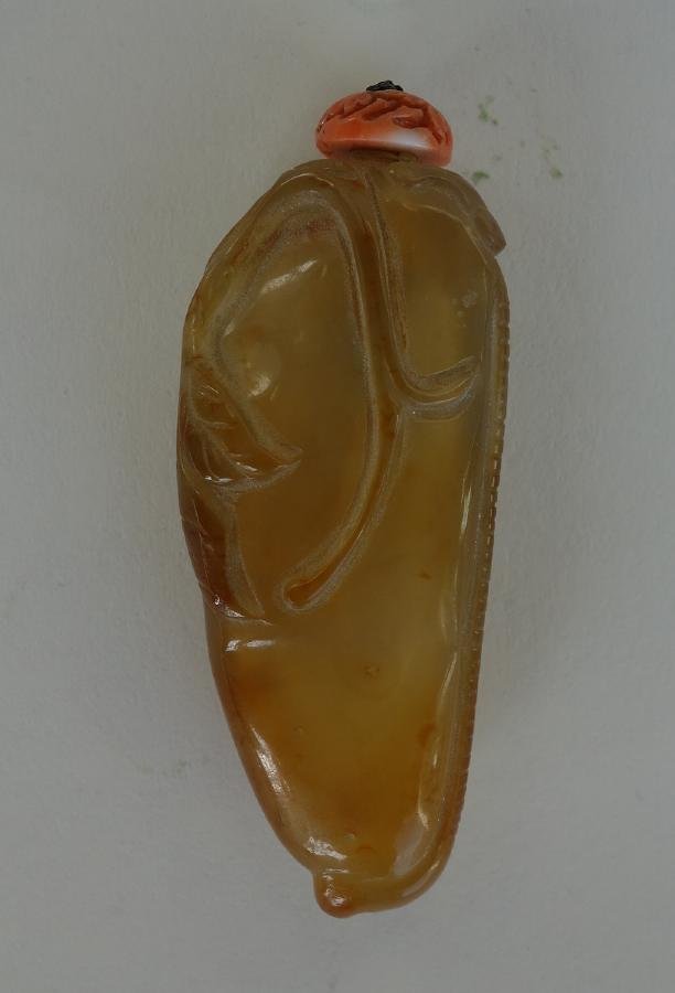 Chinese Carved Agate & Coral Snuff Bottle, Peapod: A Chinese agate snuff bottle. Carved as a pea pod with raised leaves and vines. Well hollowed. Measures 2.75" high to top of carved coral cap.
