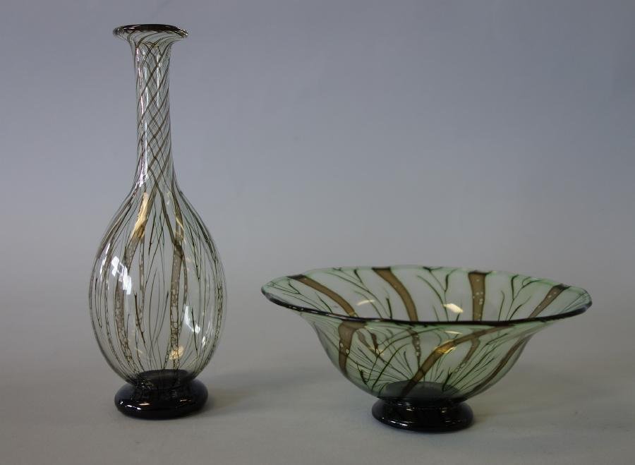 Orrefors, Eva Englund Graal Art Glass Bowl & Vase: Orrefors art glass bowl and bud vase by Eva Englund. Both pieces signed Graal, Orrefors and Eva Englund. The bowl measures 4.75" in diameter, 2" high and is numbered 1716-76. The bud vase measures 5.5