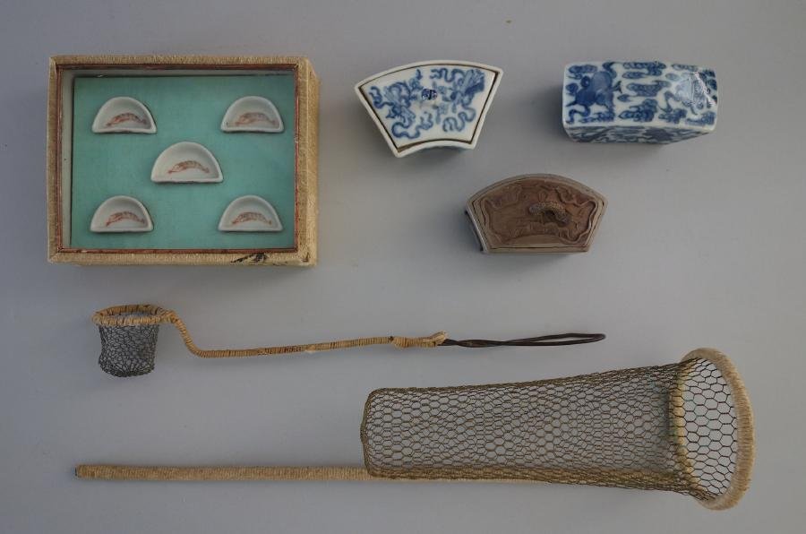 Chinese Porcelain Cricket Cage Tunnels, Dishes +: Chinese cricket cage accessories. Comprised of two blue and white porcelain cricket bridges / tunnels, together with a ceramic bridge / tunnel with lily pad motif, and a set of five porcelain feeding 
