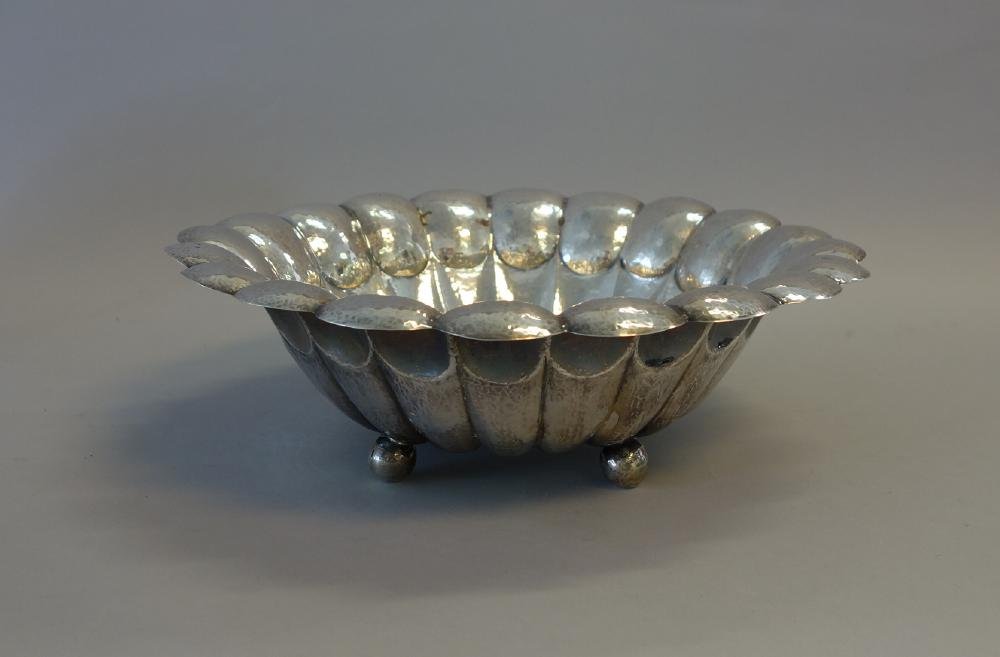 Austria Silver Hand-Hammered Centerpiece Bowl: A silver centerpiece bowl. In the style of Wiener Werkstatte. Hallmarks for Republic of Austria, early to mid 20th century. 800 silver purity mark and toucan purity standard mark. Scalloped edged bowl