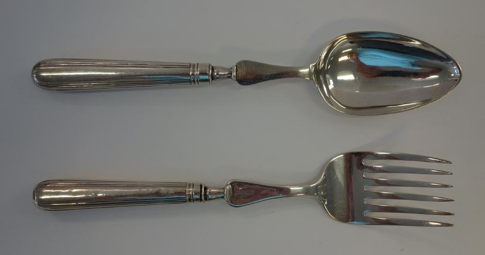 Georgian Sterling Serving Fork & Spoon: A George III English sterling silver serving fork, crested and with hallmarks for London, 1800, William Eley & William Fearn, 10-5/8" long. Together with a complementing pattern sterling silver servin