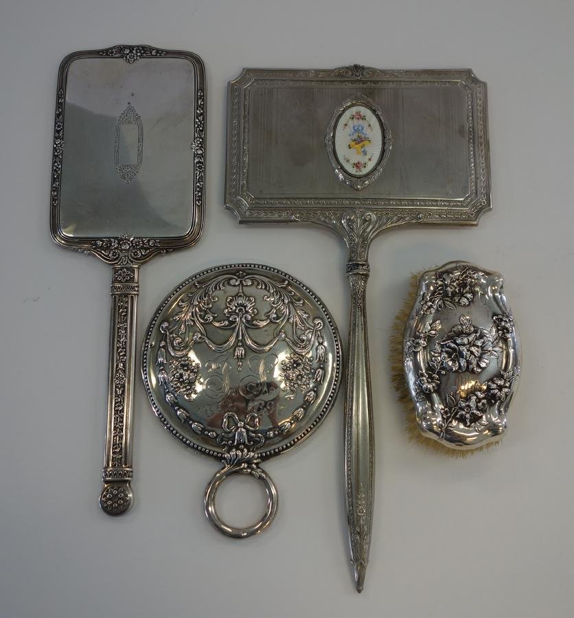 Sterling Vanity Mirrors & Clothes Brush, Gorham +: Three sterling silver hand mirrors; Comprised of a round mirror by Gorham. Embossed swag and floral motif, 5.25" dia, 7" high, and two long handled rectangular mirrors, one by R. Blackington & Co. The