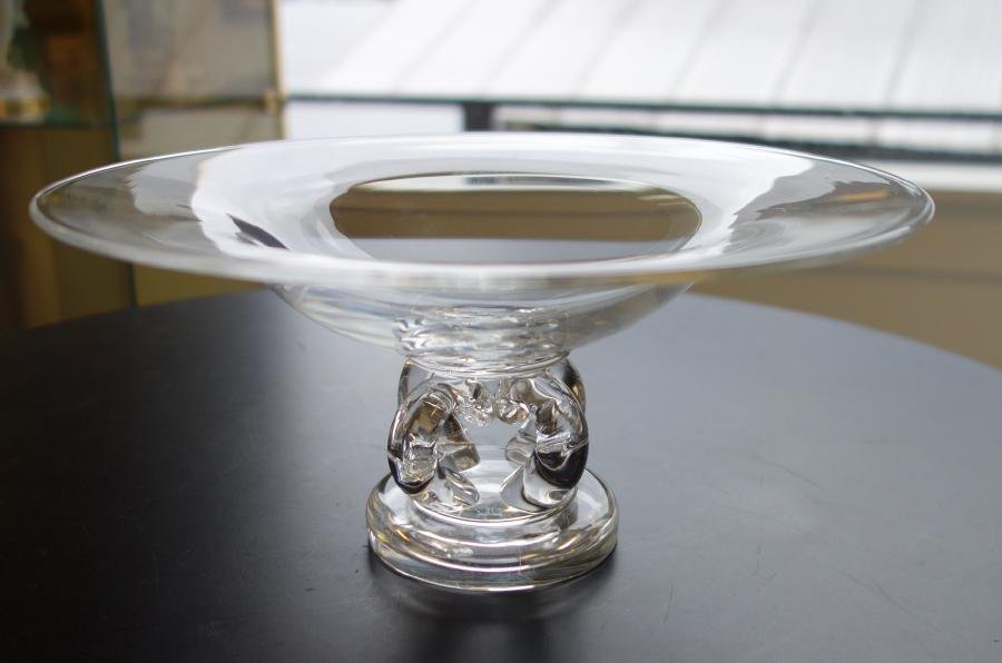 Steuben Pedestal Compote, Scroll Feet, Signed: A Steuben glass pedestal compote bowl. Footed compote with four scrolling feet. Signed underfoot. Measures 9-7/8" in diameter, 4-5/8" high.