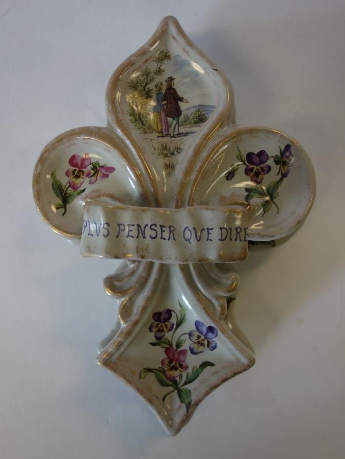 Emile Galle Faience Pottery Box, Signed: A rare French faience pottery box by Emile Galle'. Signed on the underside of lid, E. Galle' a' Nancy. Clover / cross shaped box with hand-painted flowers. The top of the lid depicts a couple walking