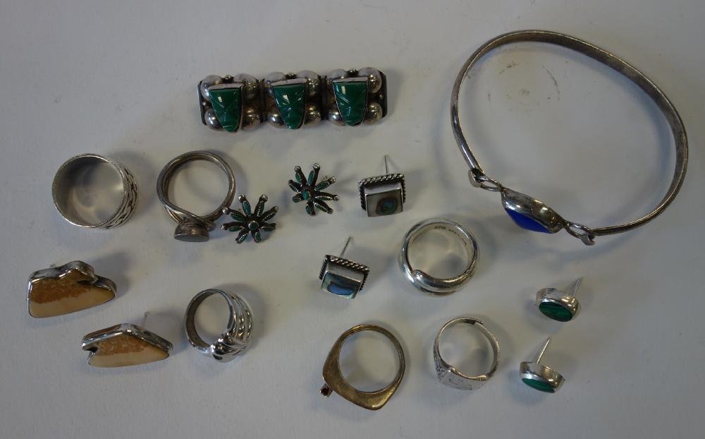 Mexican Sterling Jewelry, Lapis, Turquoise +: A group of Mexican sterling jewelry. Includes a sterling and lapis lazuli bracelet, turquoise & sterling bar pin, 4 pair of earrings, (malachite, turquoise, abalone,etc), and six rings. Overall weight