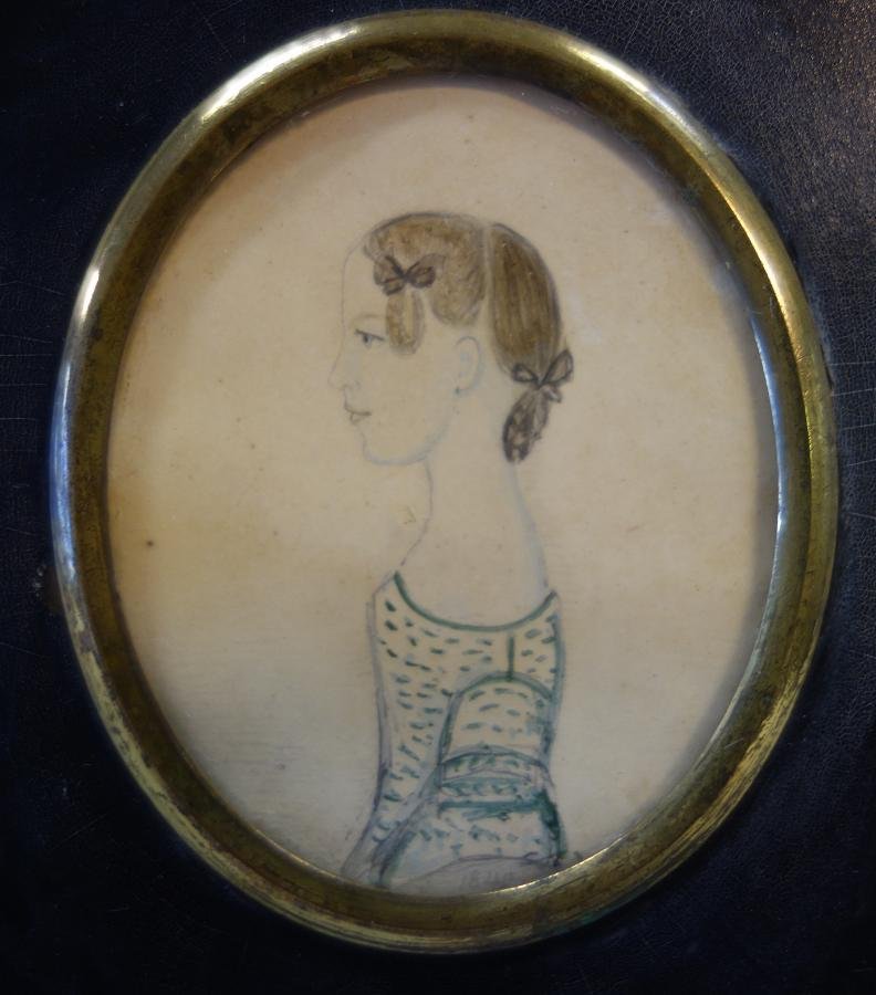 19thc Naive Portrait Miniature, dated 1842: A framed naive portrait miniature of a young girl. Early 19th century. Identified in pencil on the verso "Sarah Pole Sarinder, Died June 8th, 1842". The oval watercolor painting on cardboard measures 
