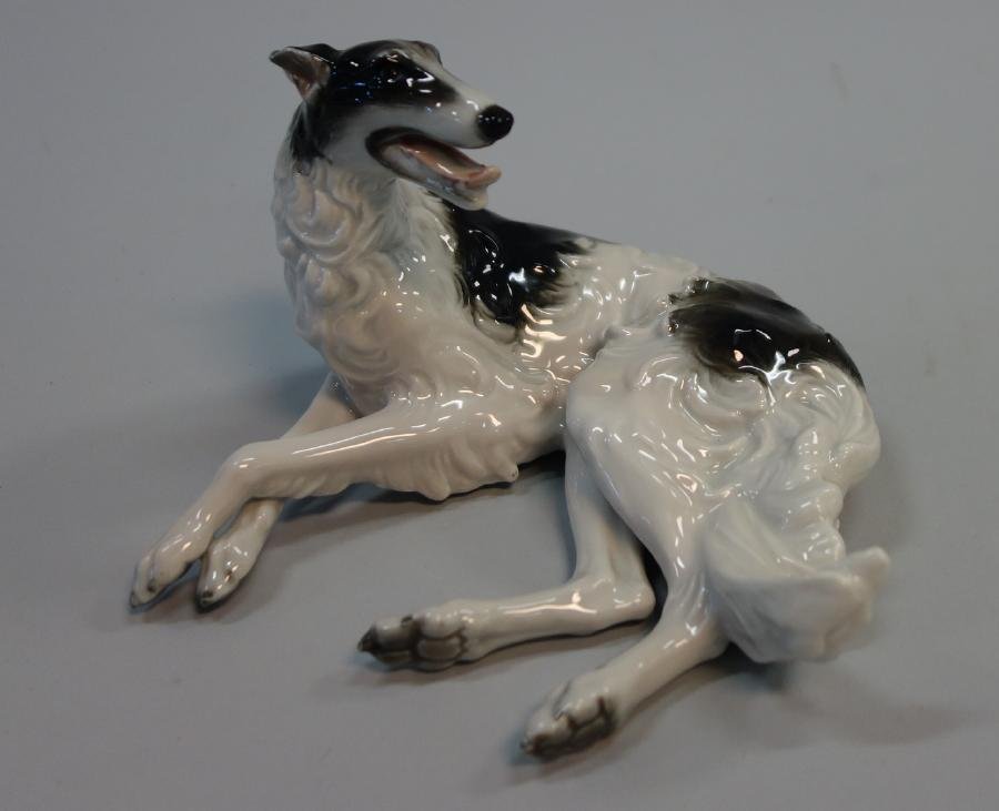 Rosenthal Borzoi Russian Wolfhound: A fine hand-painted porcelain model of a borzoi / Russian wolfhound by Rosenthal, Germany. The lounging dog measures 3.5" high, 6.25" long, 5.5" wide. CONDITION: excellent, no damage.