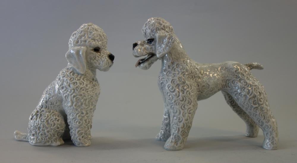 2 Rosenthal Gray Poodles, Fritz Heidenreich: Two hand-painted porcelain models of light gray poodles by Rosenthal, Germany. Sculpted by Fritz Heidenreich (each impressed on the underside F. Heidenreich). Signed underfoot with the Rosenthal marks