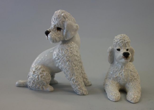 2 Rosenthal Porcelain Poodles, Fritz Heidenreich: Two hand-painted porcelain models of poodles by Rosenthal, Germany. Sculpted by Fritz Heidenreich (each impressed on the underside F. Heidenreich). Signed underfoot with the Rosenthal marks and handge
