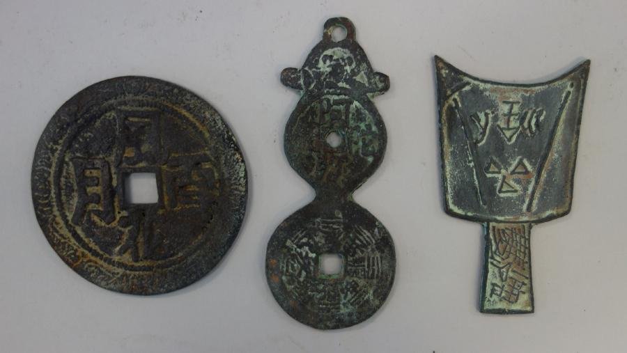 3 Chinese Bronze Coins: A group of three Chinese bronze coins. Comprised of a wedding coin, 2.75" dia., a Horoscope coin, 3.75" high, and a Chou Dynasty coin, 3" high.