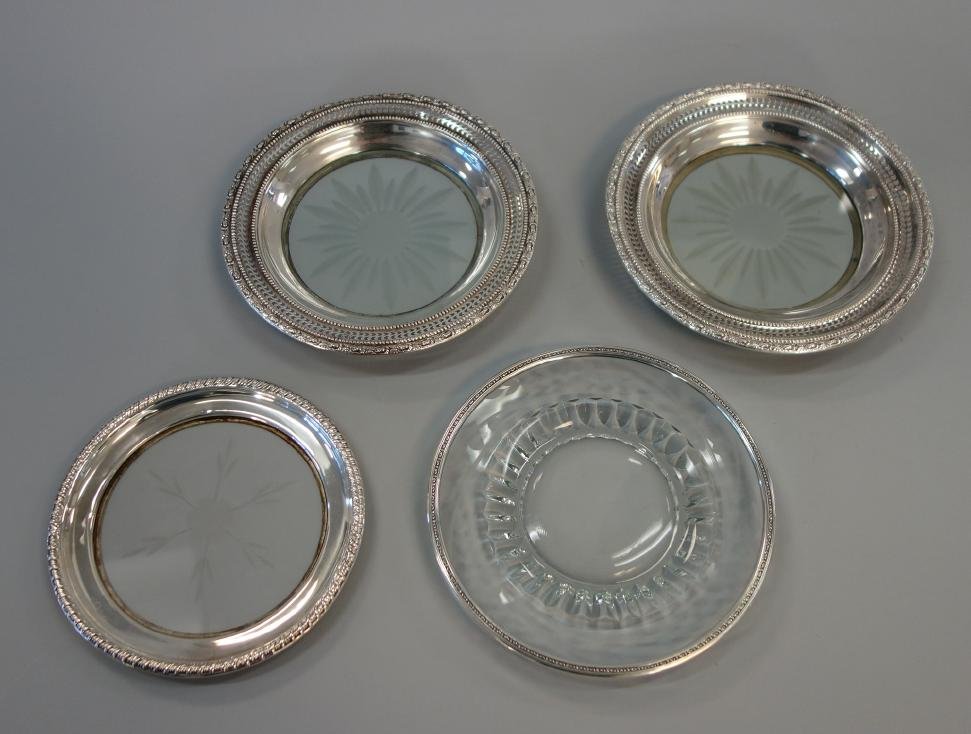 4 Sterling & Cut Glass Wine Coasters: Four sterling silver and cut glass wine coasters. Two by Frank Whiting. Measuring 5.5" to 6.5".