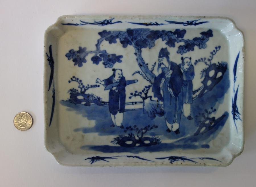 19thc Chinese Blue & White Porcelain Tray: A Chinese blue and white porcelain tray. 19th century. Underglaze blue enamel decoration depicting figures in a landscape setting. Measures 9-3/8" x 7-1/8" x 7/8" high.