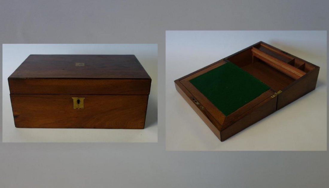 19thc English Mahogany Lap Desk: An English mahogany lap desk / box. 19th century. Brass shield shaped medallion and escutcheon. The interior with pen tray, stamp holder and inkwell holder. Measures 13.75" wide, 8.75" deep, 5.75" hig