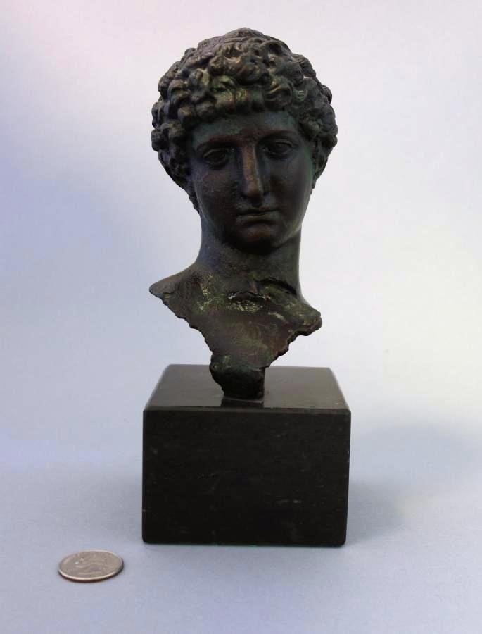 19thc Bronze Bust of a Young Greco Roman Male: Bronze bust of a young Greco-Roman male. 19th century. Possibly a depiction of a young Caesar Augustus. Mounted on a marble plinth. Overall height on base, 8".