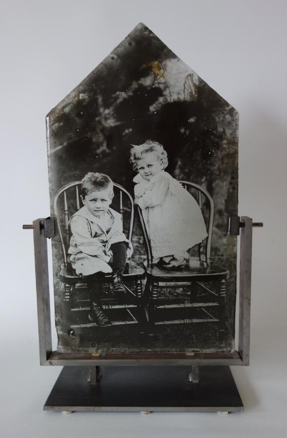 Theresa Batty, Cast Glass Photo Emulsion: A photo emulsion in cast glass by Seattle / Denmark glass artist Theresa Batty. The archival black and white photograph / photo-album snapshot, is embedded like fossils in shaped blocks of cast glass.