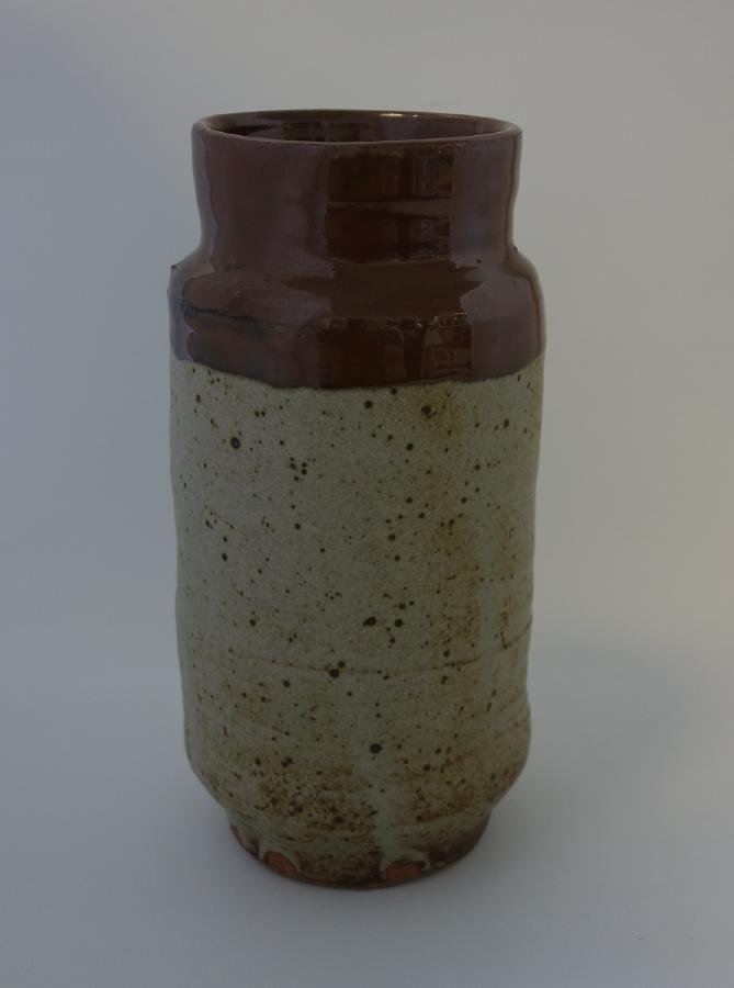 Warren Mackenzie Glazed Stoneware Vessel: A glazed stoneware vessel / vase by Warren MacKenzie (b-1924). Measures 9.25" high, 4.75" diameter.