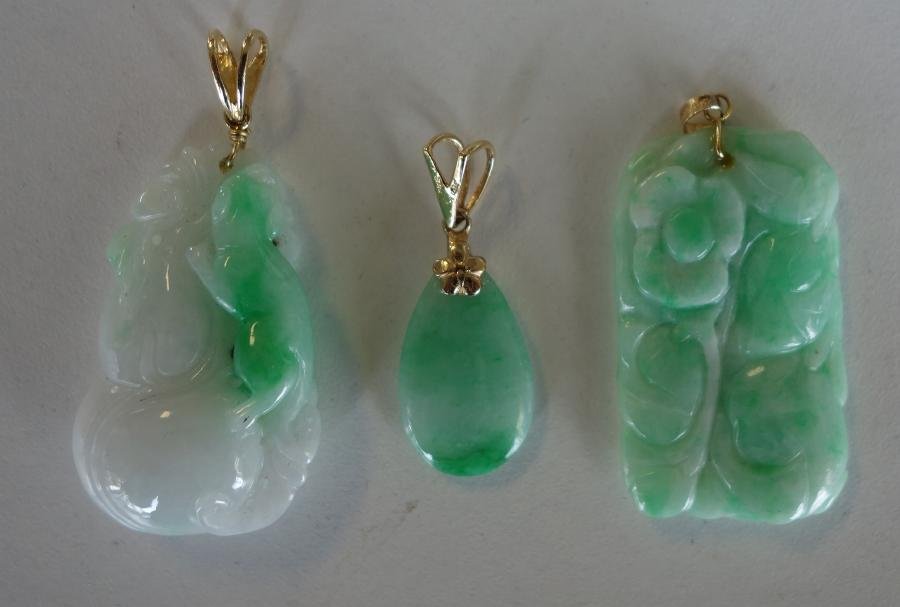 3 Chinese Carved Jade Pendants w/ 14K Gold: A group of three Chinese white jade, jadeite jade and apple green jade pendants. Each with 14K gold bail. Comprised of a carved jade depicting a rat / mouse on a large leafy gourd, 1-3/8" long. Togeth