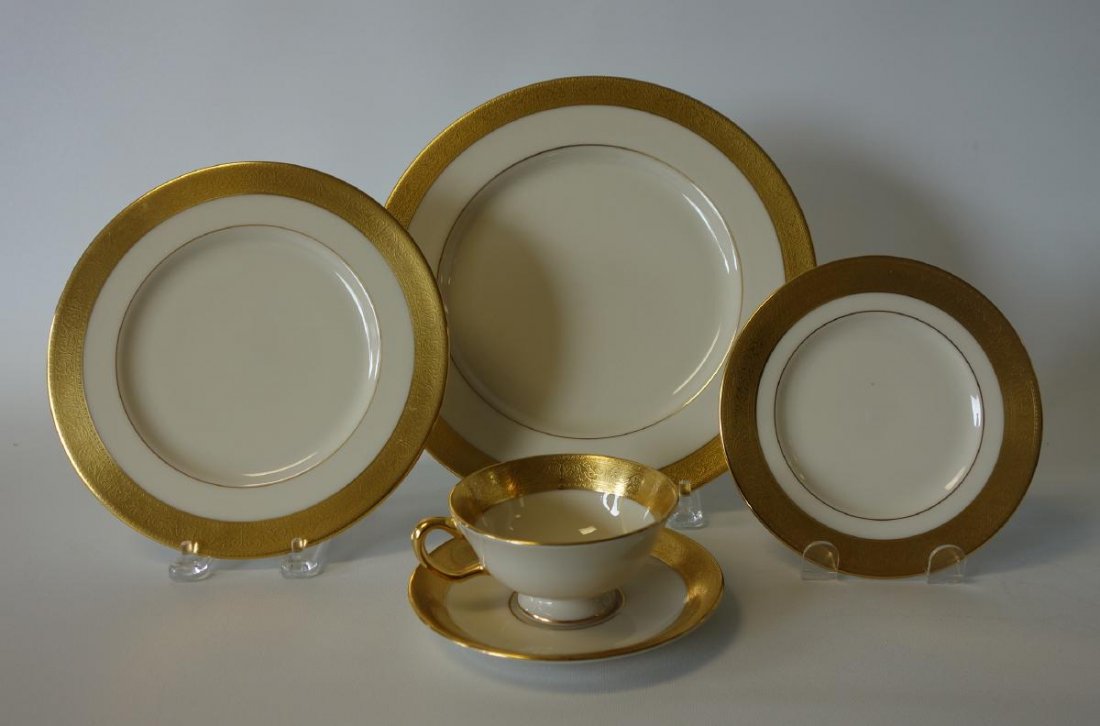 Lenox Westchester Dinner Service for 14 +: A Lenox china dinner service in the Westchester pattern, M-139. Service for 14. Gold scrolling border on ivory. Comprised of 17 dinner plates, 10-5/8" diameter, 14 each of salad / dessert plates, brea