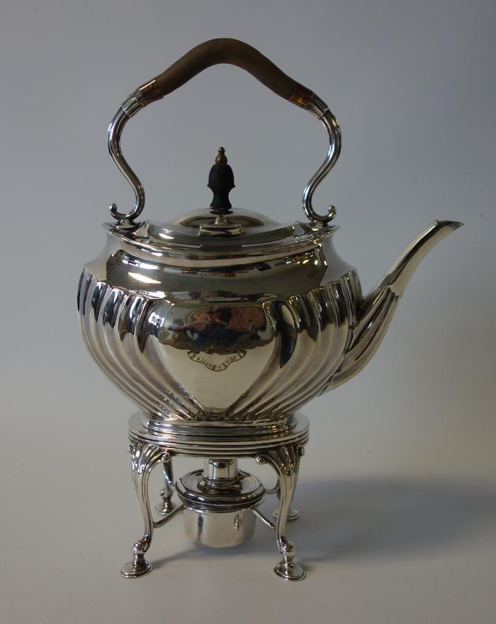 Atkin of Sheffield Silverplate Kettle on Stand: A silverplate kettle on stand by Atkin Brothers, of Sheffield, England, c.1889. Engraved Irish crest for the McGrath Family, the motto Salus In Fide (Salvation by Faith). Overall measurements on stand