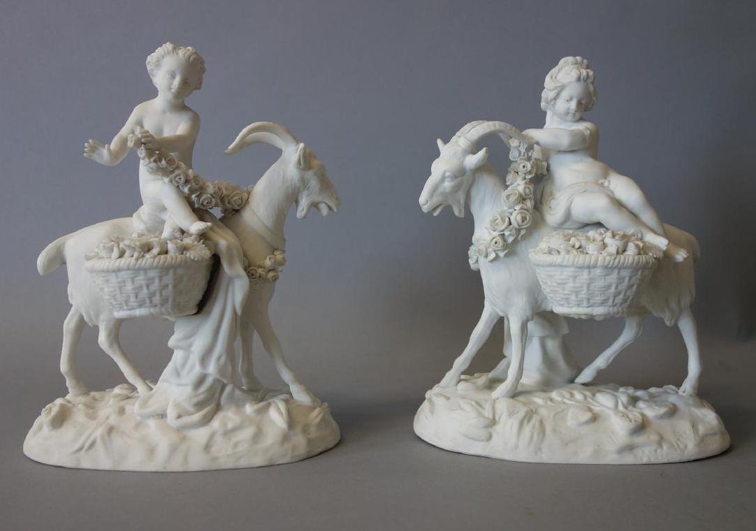 19thc Sevres Parian Figural Group (pair): A pair of Sevres parian porcelain figural groups. Modeled as nude male and female putti riding goats with garlands and baskets of flowers. Each signed underfoot with the Sevres interlocking cipher. Me