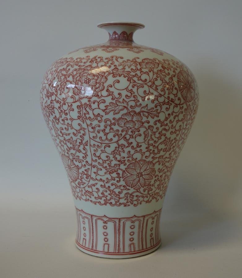 Chinese Porcelain Meiping Vase, Signed: A Chinese porcelain "Meiping" vase. Underglaze copper enamels depicting a motif of flowers, vines and leaves. Signed underfoot in underglaze blue bearing an apocryphal reign mark denoting Qing Dynasty