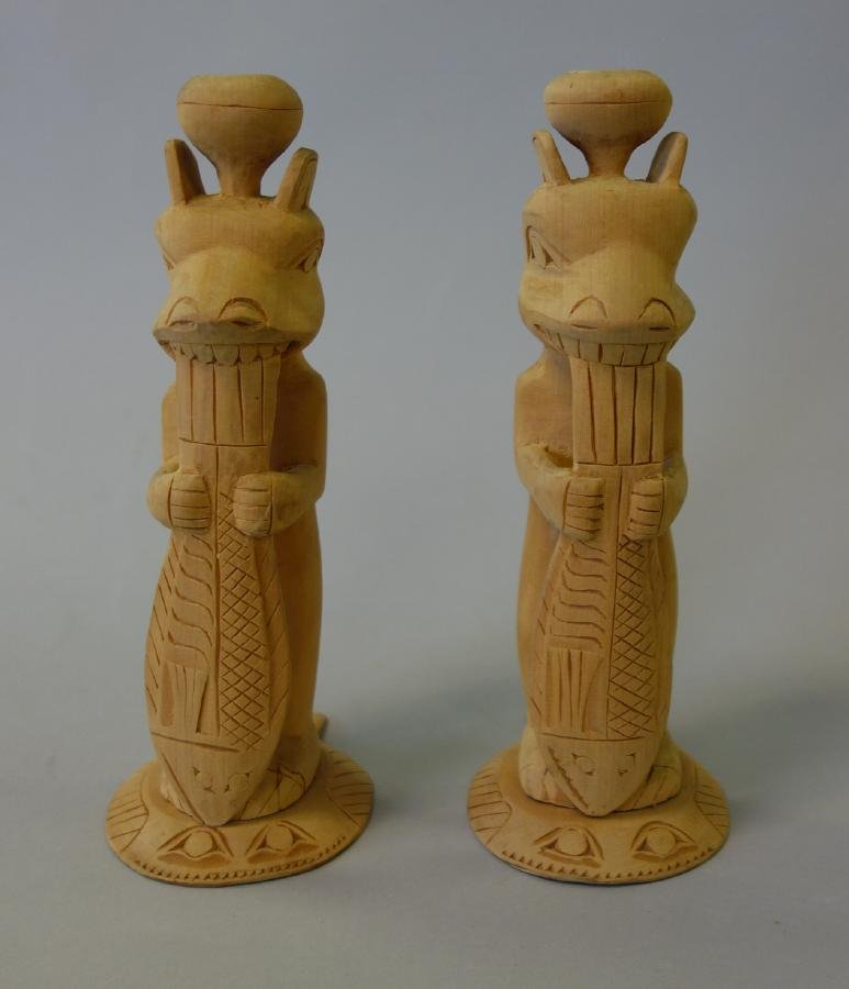 Tsimshian / Tlingit Cedar Totem Candlesticks c1930: A rare pair of Pacific Northwest Coast carved cedar totem pole candlestick / candle holders. Tsimshian / Tlingit Peoples, Alaska c.1930. Formed as a half bear / half man holding a large salmon in its 