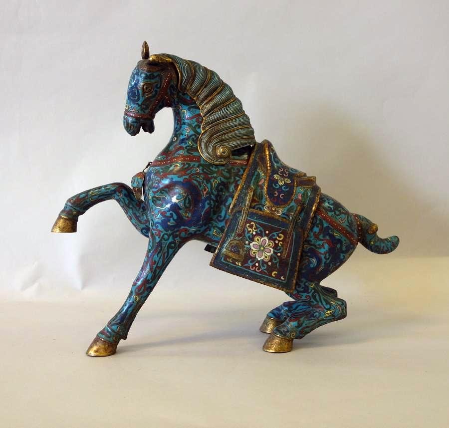 Chinese Cloisonne Rearing Horse, 15.75" high: A large Chinese cloisonne enamel figure of a rearing horse. Tang Style, Republic period. Well detailed horse with removable mane, saddle and saddle bags. Measures 15.75" high, 18" long, 5.25" wide.