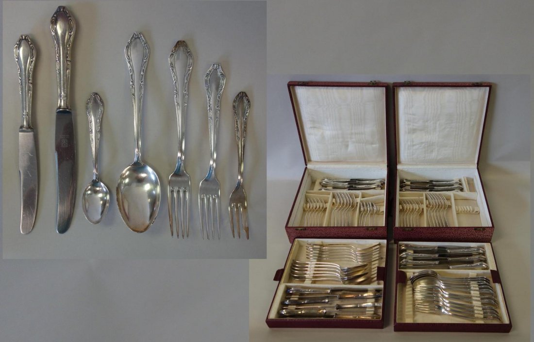 Continental Silverplate Flatware, 100 gram plating: A set of German Continental silverplate flatware. 100 gram plating. The knives marked Rostfrei Solingen. The set in two cases, is comprised of 12 each of dinner forks, dinner knives, salad forks, sala