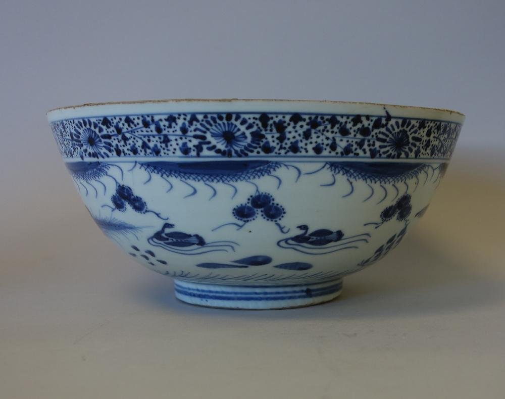 Chinese Porcelain Punch Bowl, Ming Chenghua Mark: A Chinese blue and white porcelain punch bowl. The underside bearing a six-character mark in underglaze blue, denoting Ming Dynasty, Chenghua reign. The interior decorated with a duck swimming in a la