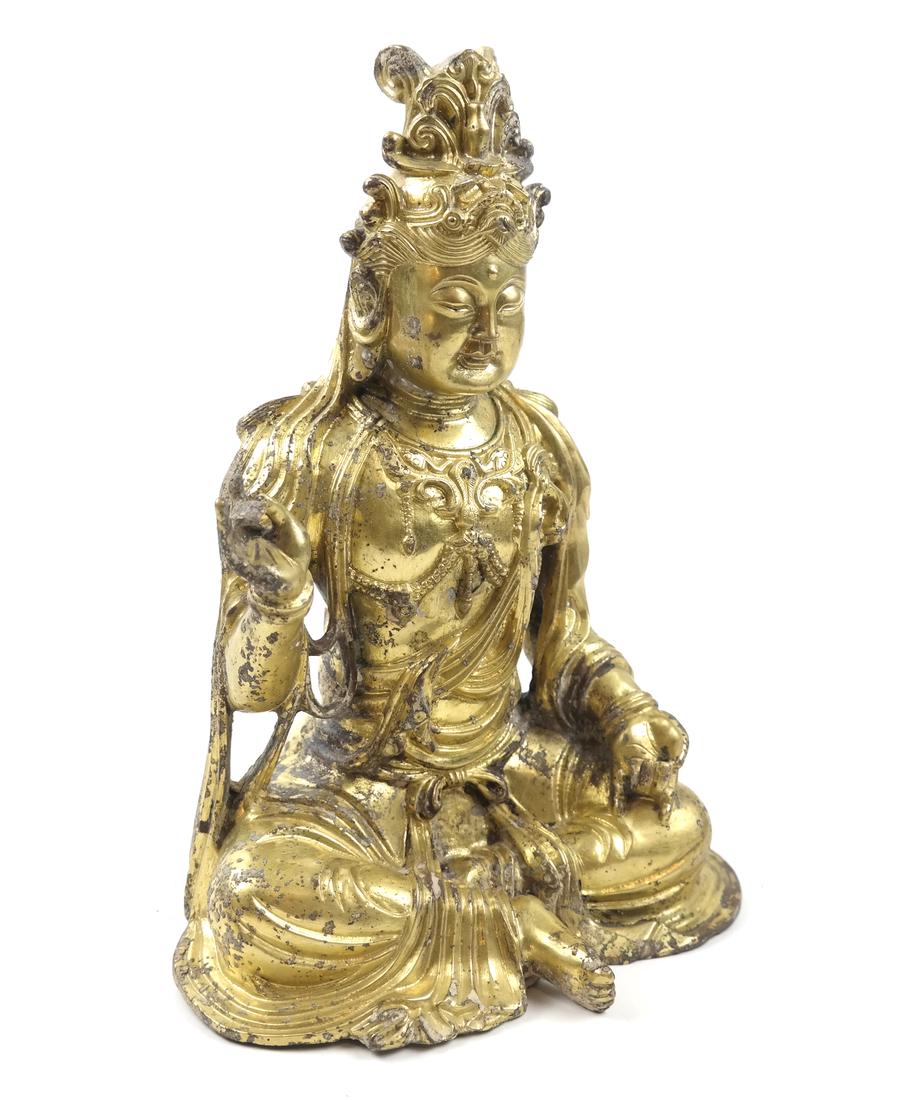 AN ASIAN GILT-BRONZE SEATED FIGURE OF A BODHISATTVA (1 of 10)