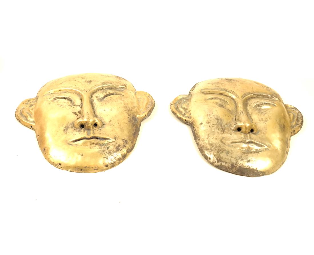A PAIR OF LARGE SILVER-GILT FUNERARY STYLE MASKS (1 of 10)