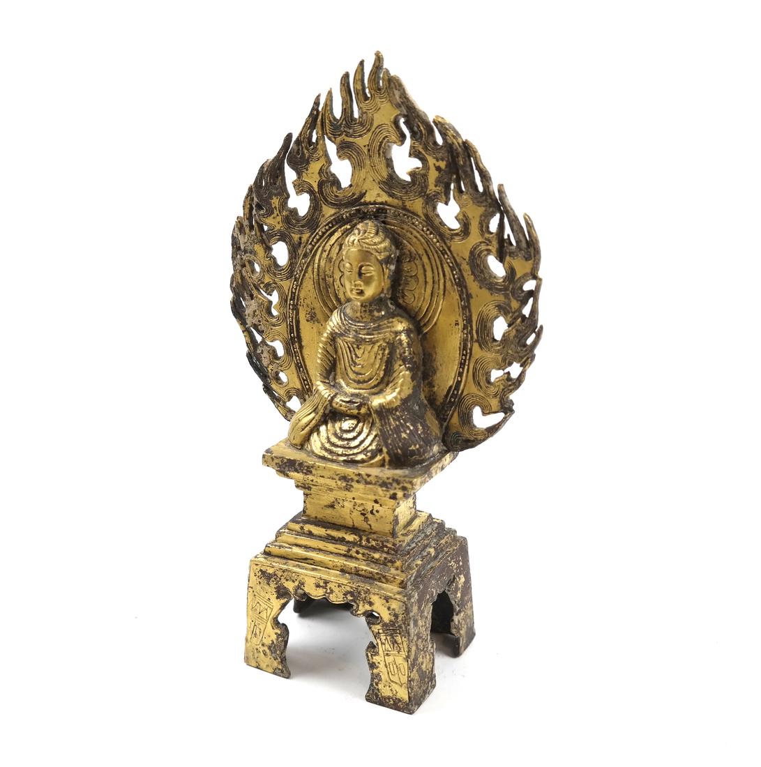 AN ASIAN SMALL GILT-BRONZE SEATED VOTIVE FIGURE OF (1 of 9)