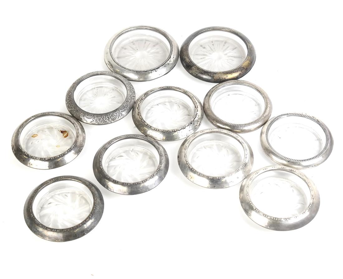 11 Silver and Glass Coasters: 11 silver and glass coasters.